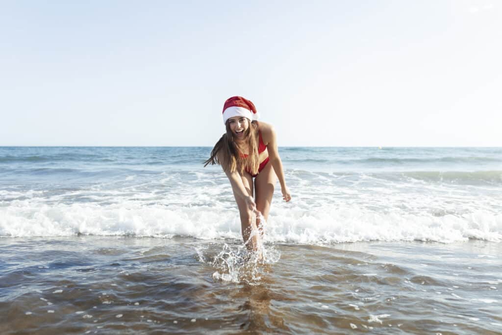 Girl on the beach at Christmas on the Costa Blanca of Spain