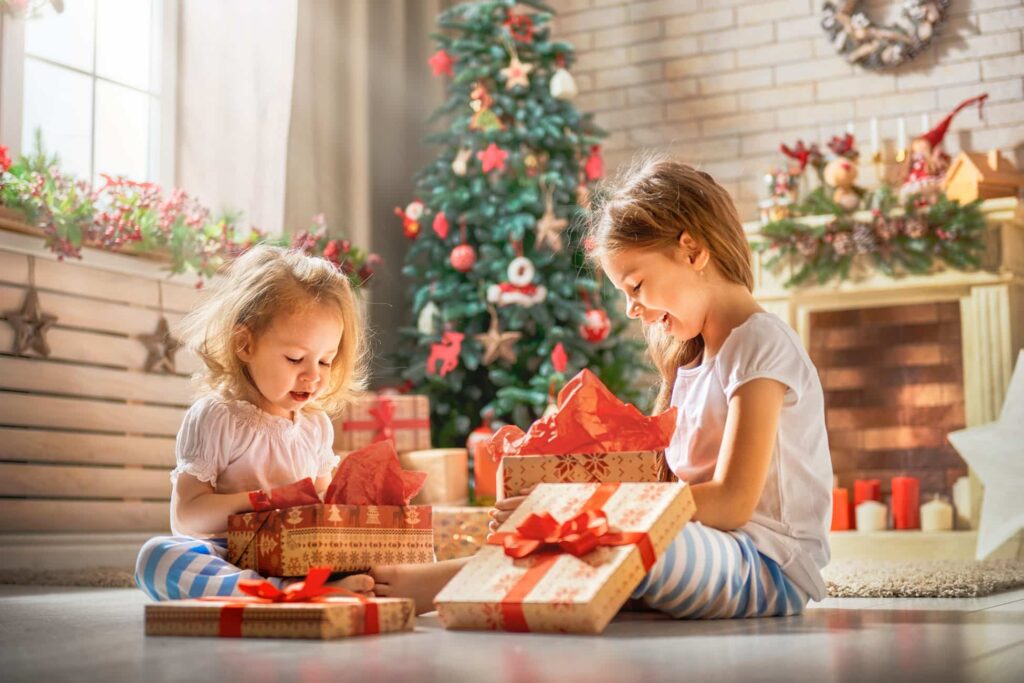 Children opening Christmas presents